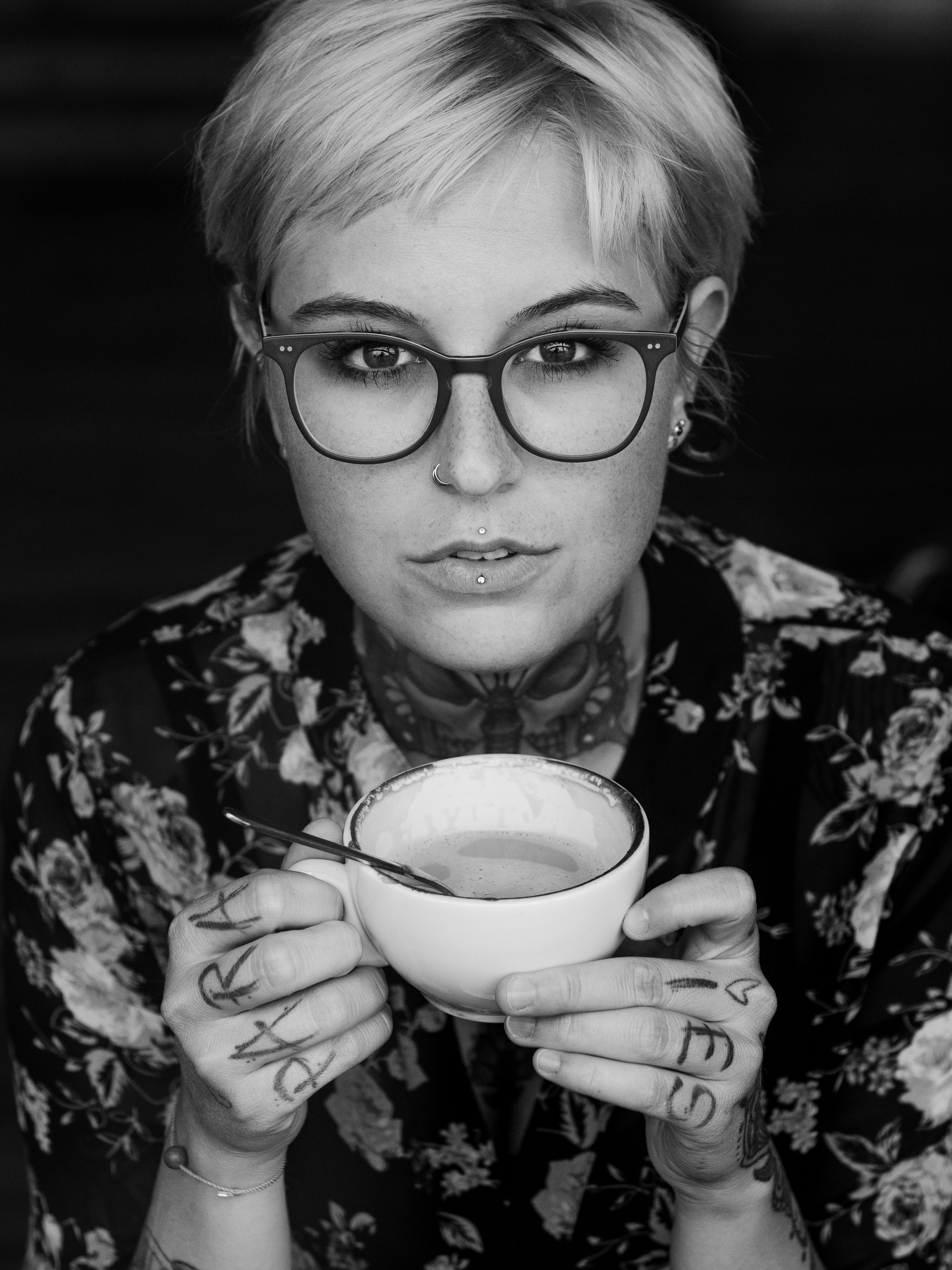 Black and white portrait at a wall