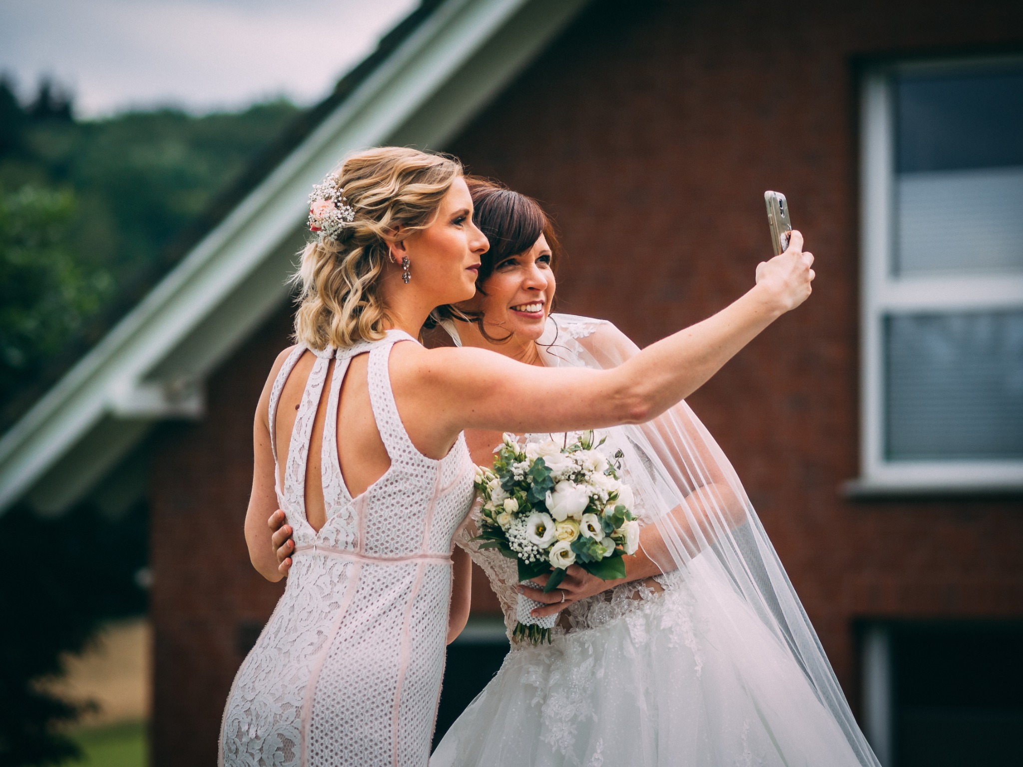 Bride and friend taking a selfie